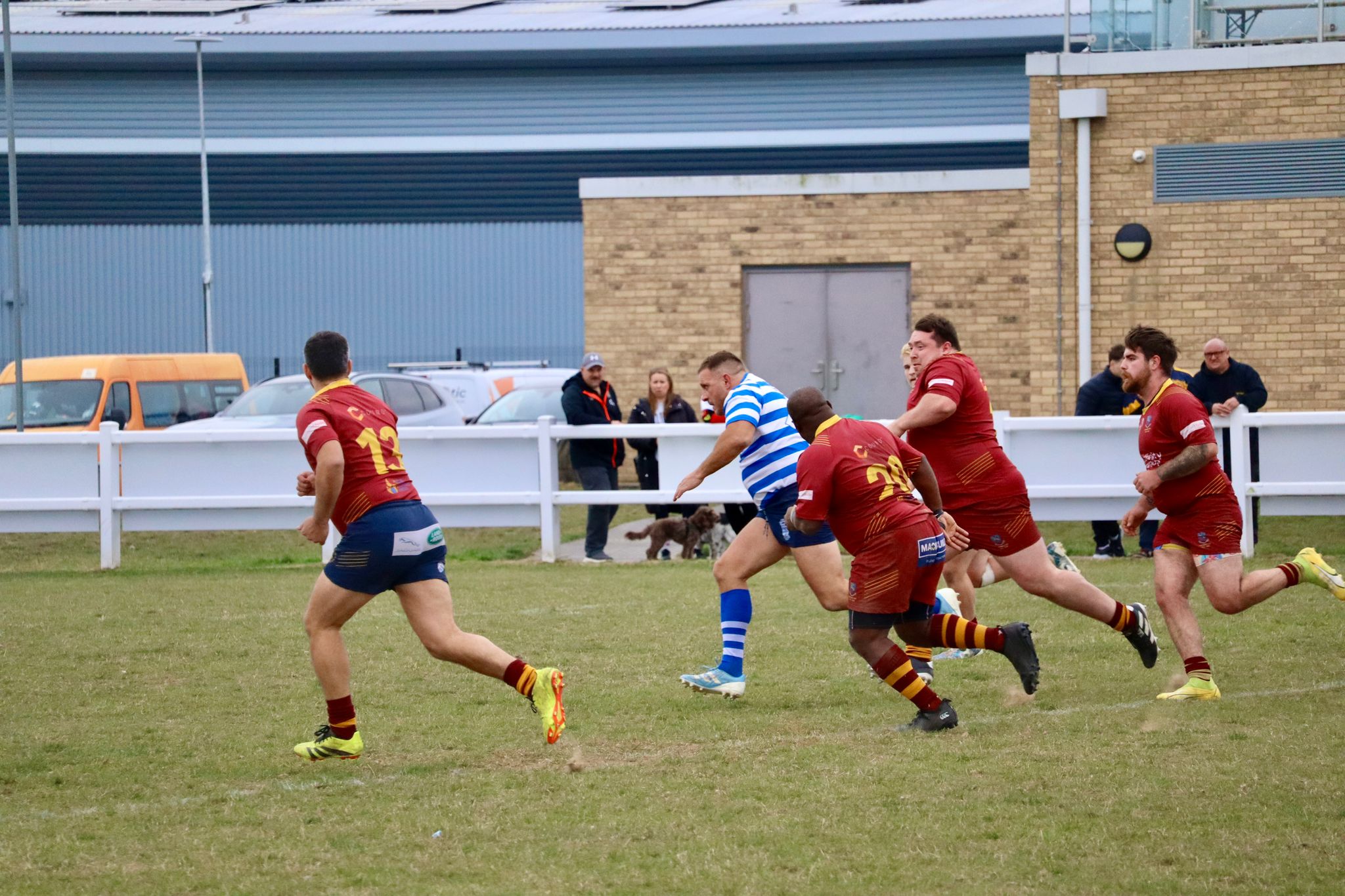 Wanstead RFC player chasing a kick